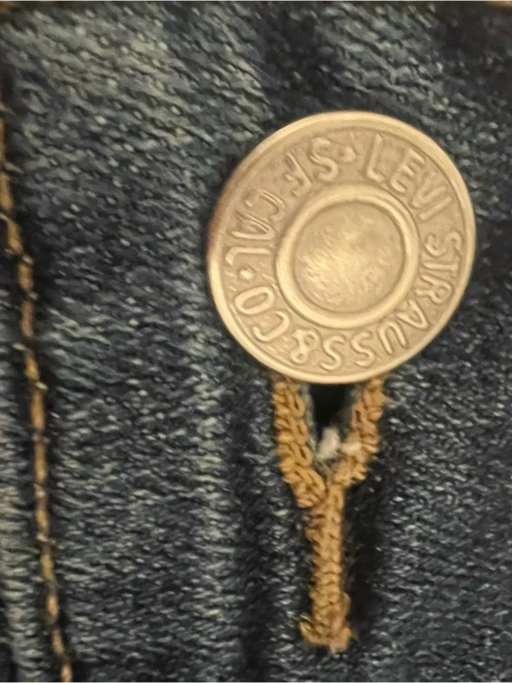 Levi's Dark Blue Denim with Tan Stitch Button Close-Up - Picture 5 of 9